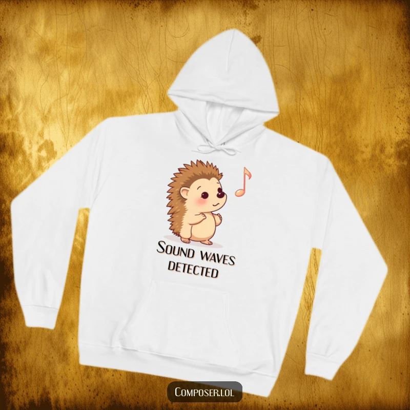 Funny Hoodie: Adorable cartoon hedgehog captivated by a large musical note, offering cozy comfort and a humorous, heartwarming design.