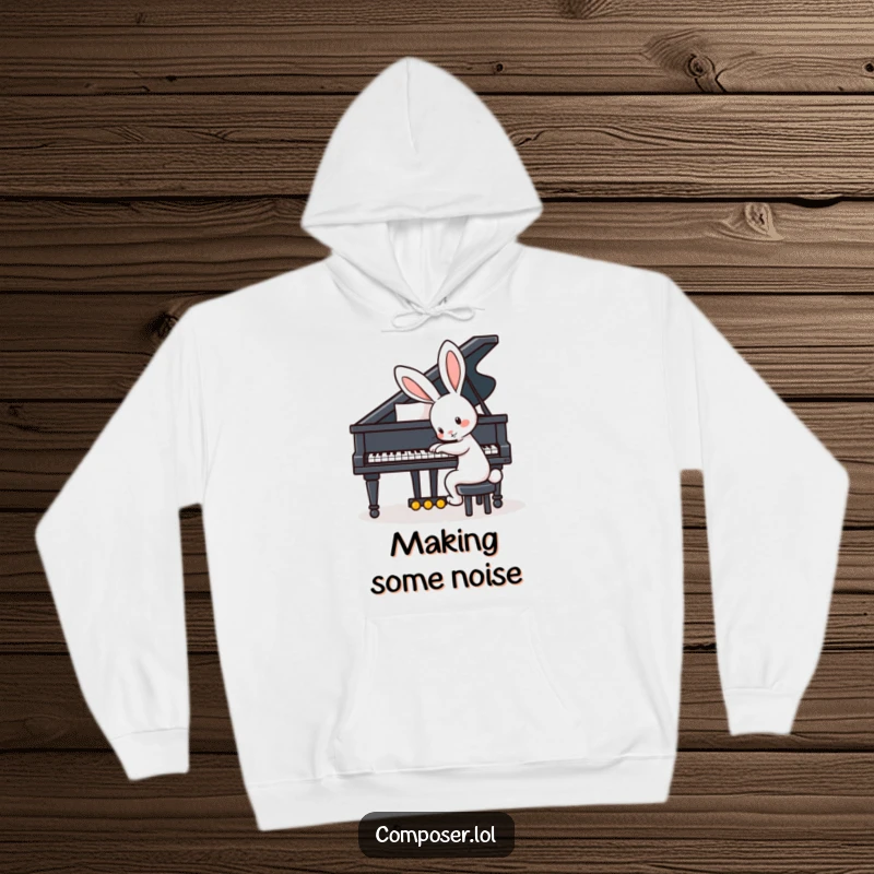 Funny hoodie featuring a playful rabbit with big ears enthusiastically tapping the keys of a grand piano, lost in the music.