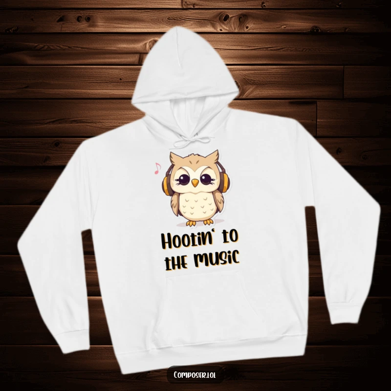 Funny, cozy hoodie with a curious owl wearing headphones and nodding to music, perfect for music lovers.