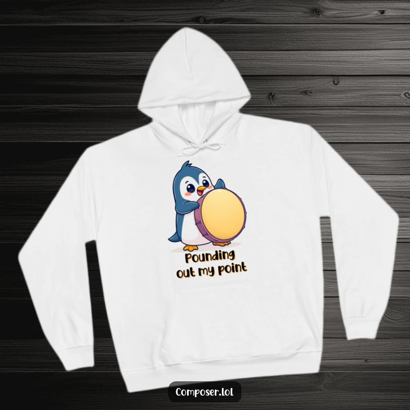 Funny Penguin Hoodie: A playful penguin character enthusiastically pounds a giant drum, embodying musical energy.