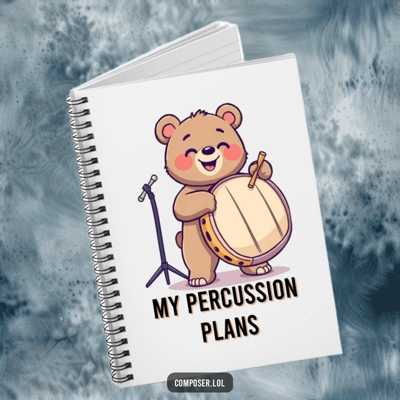 Funny, playful bear drumming on a large drum, on the cover of a notebook. Great for musicians and writers.
