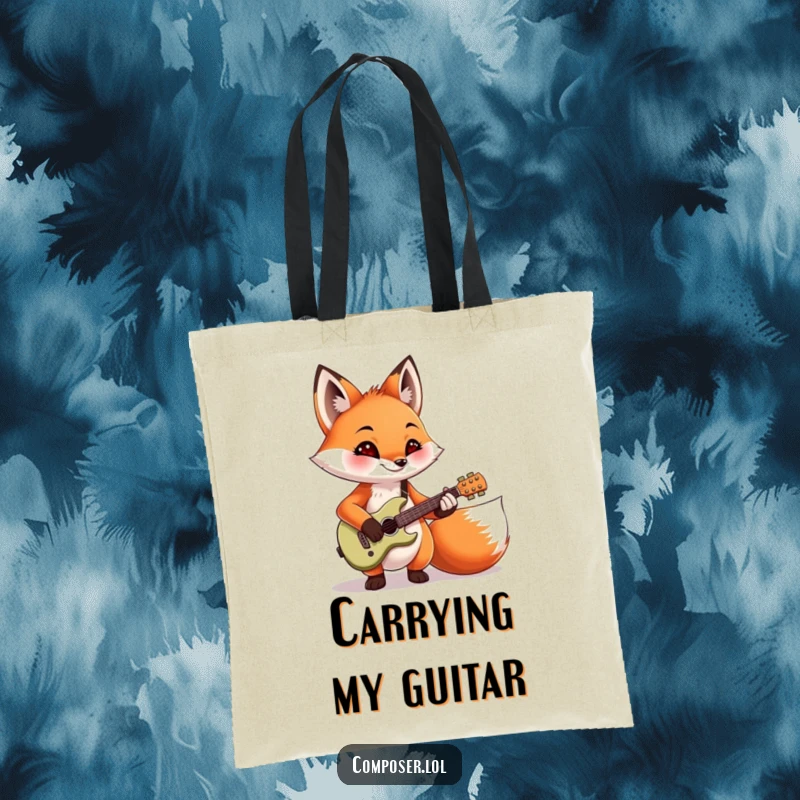 Funny mischievous fox strumming a tiny guitar, printed on a sturdy tote bag. Ideal for carrying groceries or music gear.