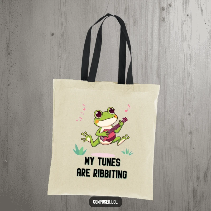 Funny tote bag showing a joyful frog composer leaping with excitement while creating a new catchy tune, full of life.